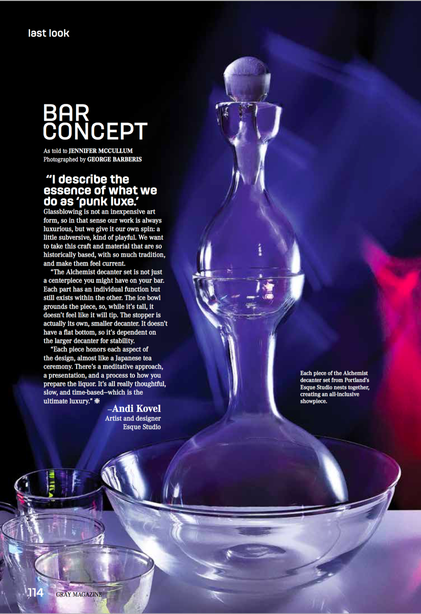 Glass decanter with text on a dark background
